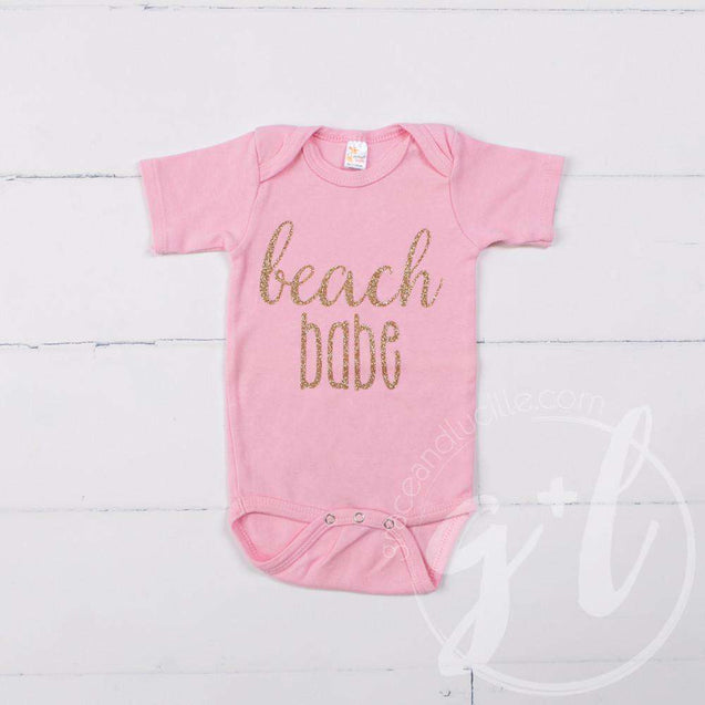 Pink Onesie with "BEACH BABE" Gold Graphics - Grace and Lucille