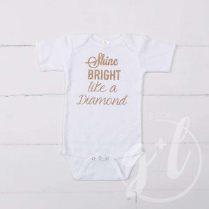 White Onesie with"SHINE BRIGHT LIKE A DIAMOND" Gold Graphics - Grace and Lucille