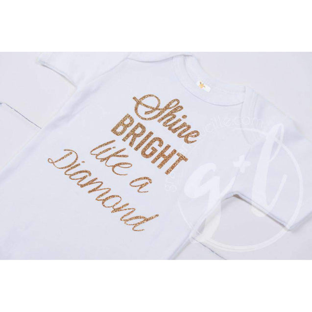 White Onesie with"SHINE BRIGHT LIKE A DIAMOND" Gold Graphics - Grace and Lucille