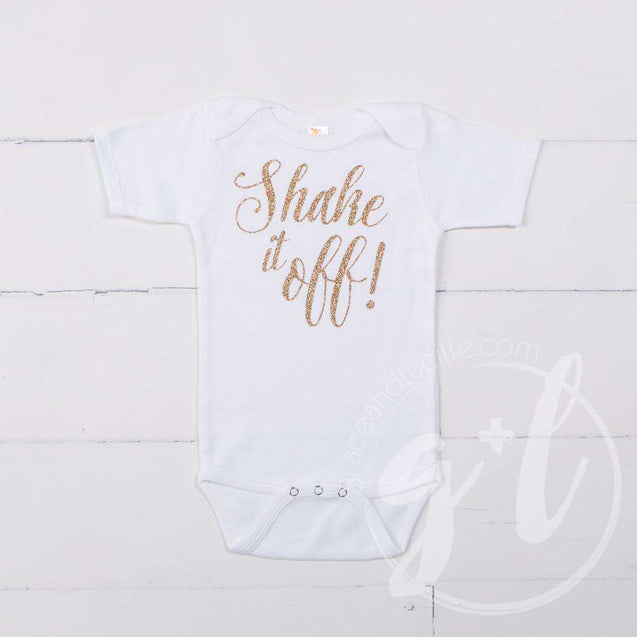 White Onesie with "SHAKE IT OFF!" Gold Graphics - Grace and Lucille